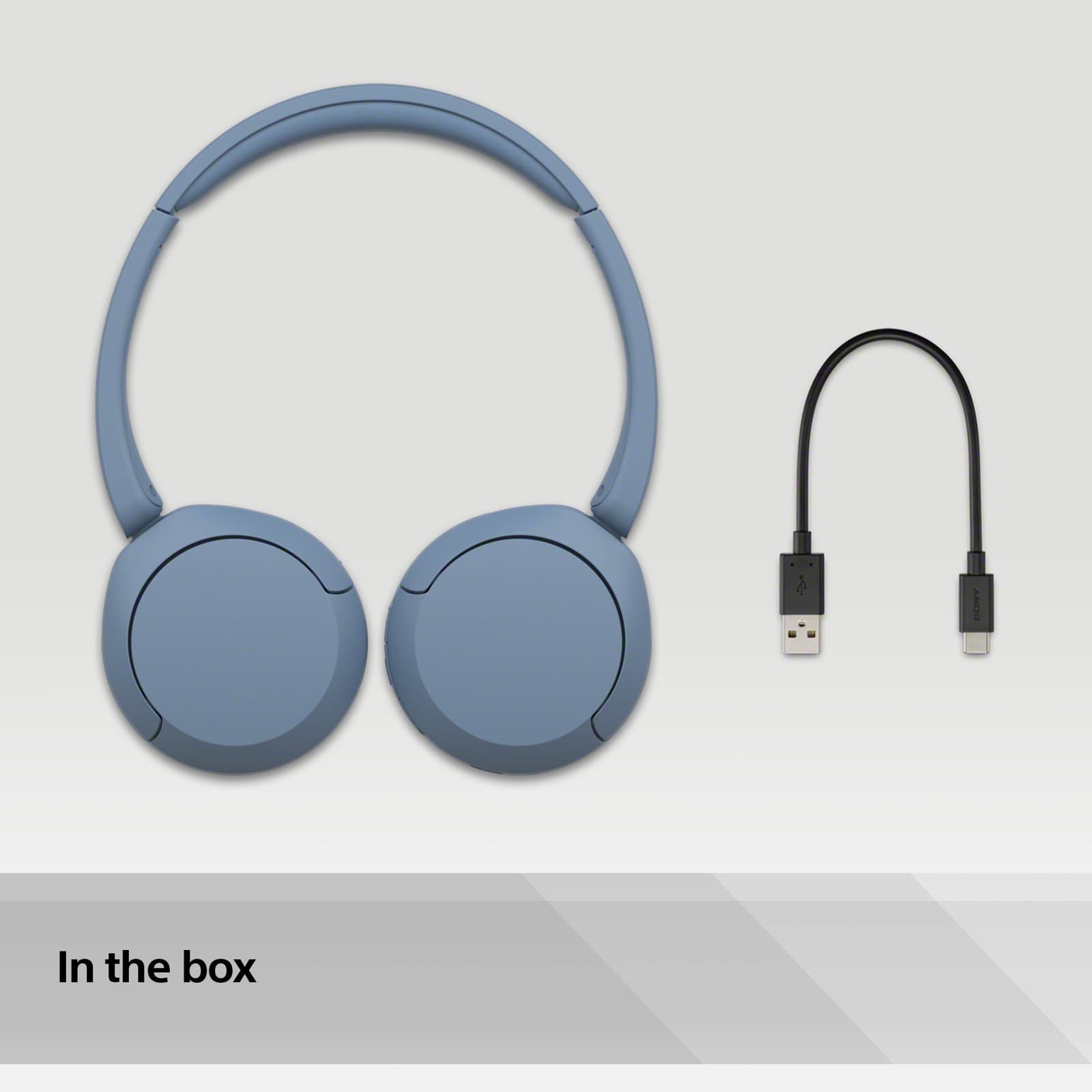 Sony's in-the-box picture: blue WH-CH520 headphones beside a USB cable