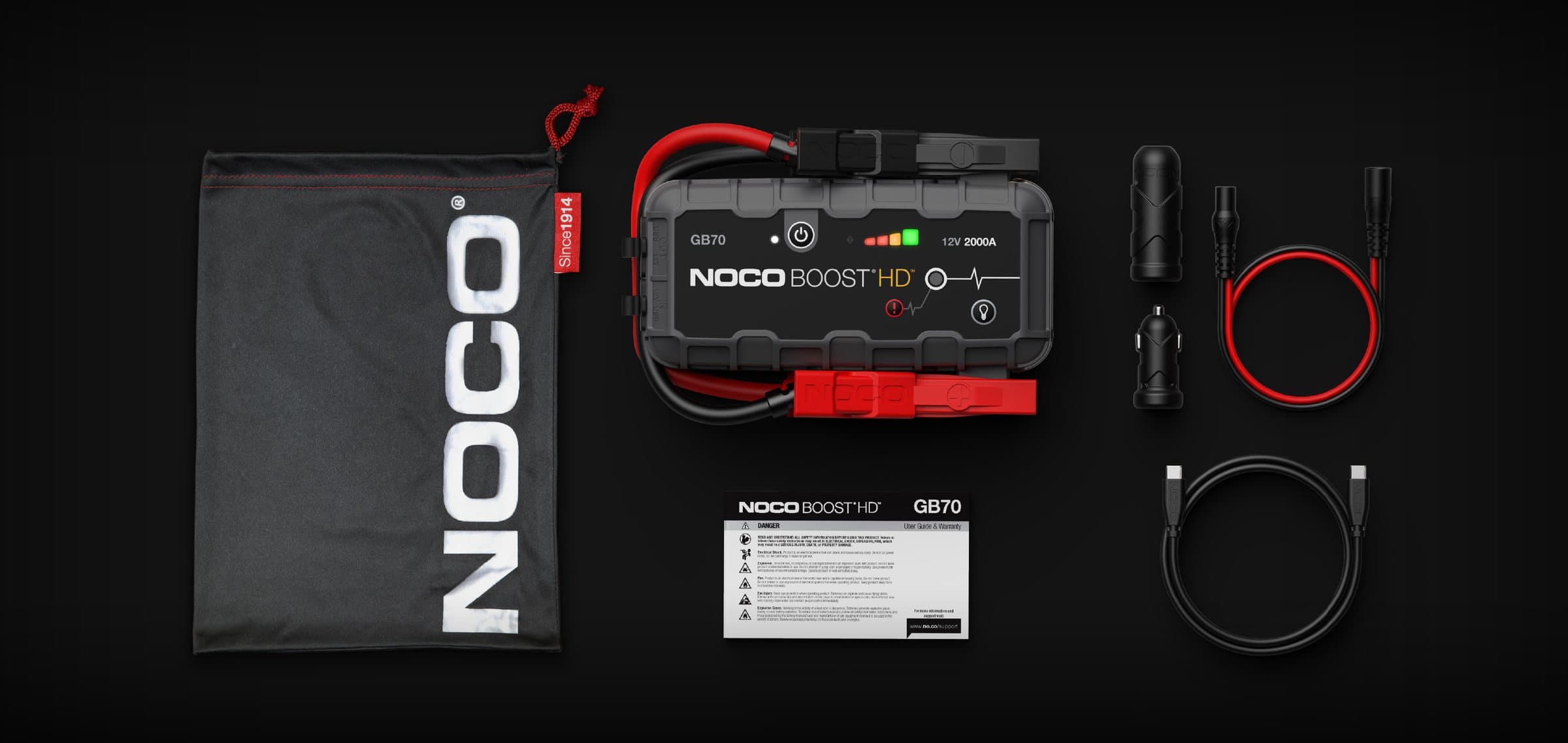 The GB70 laid out with its microfibre storage bag, XGC 12V male and female adapters, XGC extension cable, USB-C to USB-C cable and safety leaflet